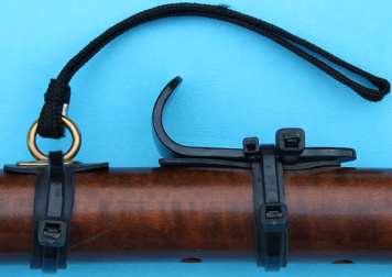 neck strap eyelet and thumb rest on a bass crumhorn